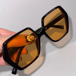 Black sunglasses with orange lens
